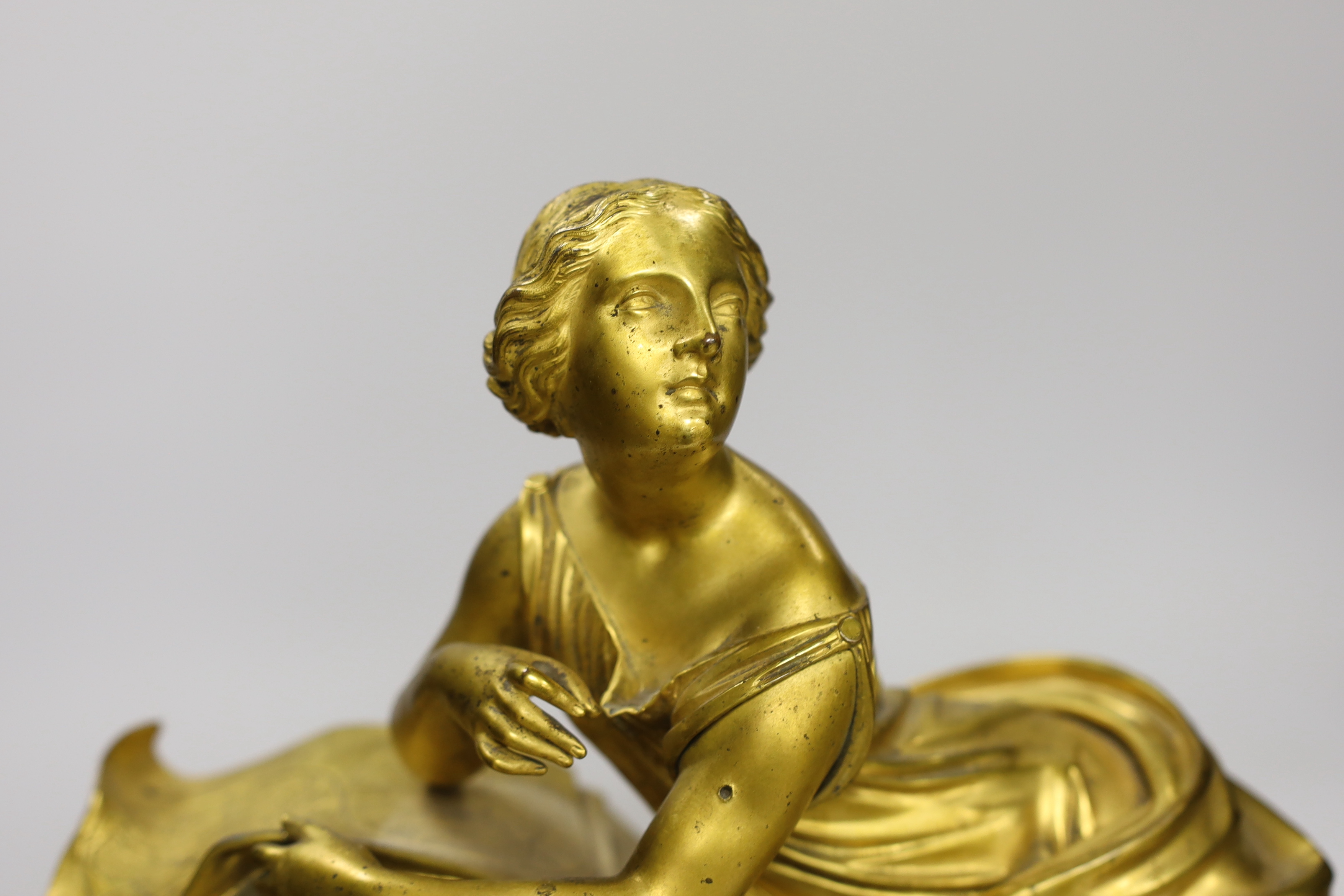 A late 19th century French ormolu and serpentine figural mantel clock, no key or pendulum, one foot missing, 47cm wide